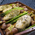 Sheet Pan Roasted Garlic and Herb Chicken is a rustic and incredible dish. Surrounded by asparagus and roasted baby russet potatoes this meal is loaded with amazing garlic butter herb flavour. via @fitcheerldr #sheetpan #mealprep #chickendinner #chicken #buzzfeedfood