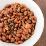 These Instant Pot BBQ Brown Sugar Baked Beans may be one of the easiest recipes I’ve ever cooked. You literally just dump all of the ingredients into the Instant Pot and walk away. No fuss, no muss.  This is an adaptation of my husband's crockpot beans, but instead of taking 6 hours to make, they only take an hour in the Instant Pot! #instantpotrecipe #bbqrecipe #brownbeans #tailgating