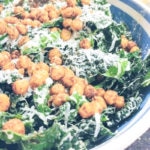 Close shot of a Kale Caesar salad with garlic parmesan chickpea croutons