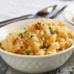 Homemade creamy baked mac and cheese doesn’t have to be complicated with layers of ingredients to be the soul-warming food you crave. This homemade baked macaroni and cheese is my most favorite and has pleased crowds, small families, kids and picky eaters alike–give it a try and you’ll see why. #comfortfood #kidfriendly #casserole #pastarecipe #macandcheese #dinnerinspiration