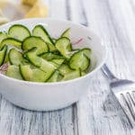 White bowl spiralized cucmber salad