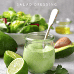 Creamy avocado and lime salad dressing in a jar with a spoon