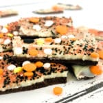 Pinterest image for Halloween Chocolate Bark - This Double Chocolate Halloween Bark recipe only takes minutes to make and is so easy that even your kids can make it. Use your imagination and make it as spooky as you want!
