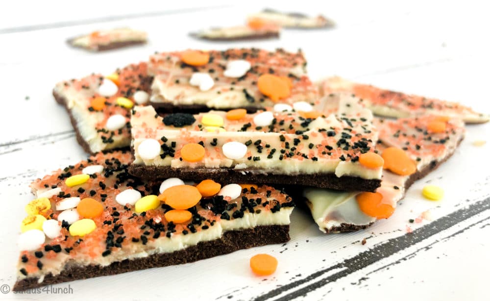 Pinterest image for Halloween Chocolate Bark - This Double Chocolate Halloween Bark recipe only takes minutes to make and is so easy that even your kids can make it. Use your imagination and make it as spooky as you want!