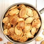 5 Easy Steps to the Perfect Roasted Pumpkin Seeds - Next time you carve pumpkins or cook fresh pumpkins don't throw out the pumpkin seeds. They make great snacks that are rich in fiber and kids love them. Purists will want only salt as a seasoning, but if you're feeling adventurous, experiment and have fun with seasoning blends. #halloween #pumpkin #recipe
