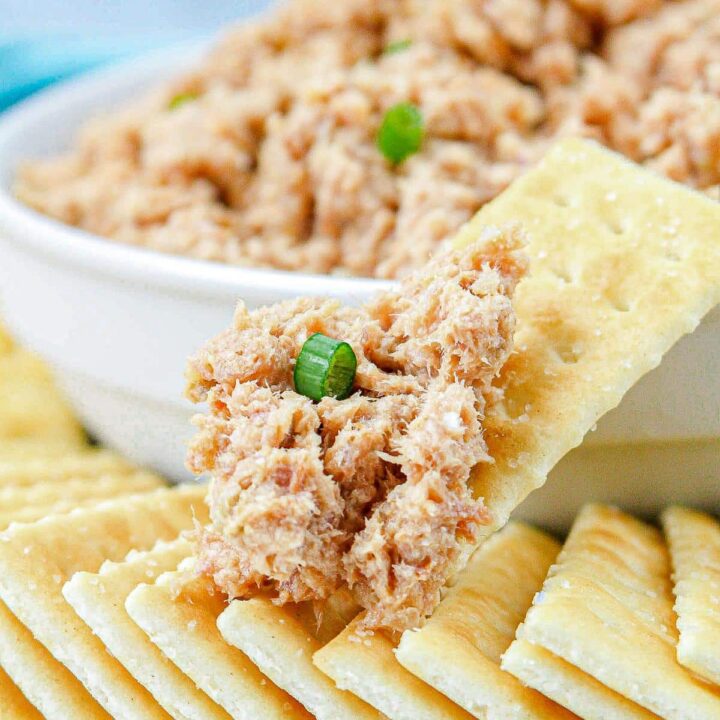 White bowl with deviled ham spread in it with saltine crackers around it and a close up of a saltine cracker with deviled ham spread on it.