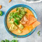Overhead photo of instant pot white chicken chili on a grey table.