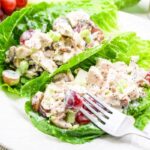 Sonoma chicken salad with grapes and poppy seed dressing served in lettuce cups, ready to eat.