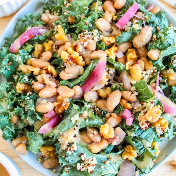 Butterbean and Walnut Kale Salad with Maple Tahini Dressing Recipe 9 - Give these 24 healthy winter salads to make in January a try. Each one is made with fresh seasonal produce to nourish and keep you healthy all winter long.