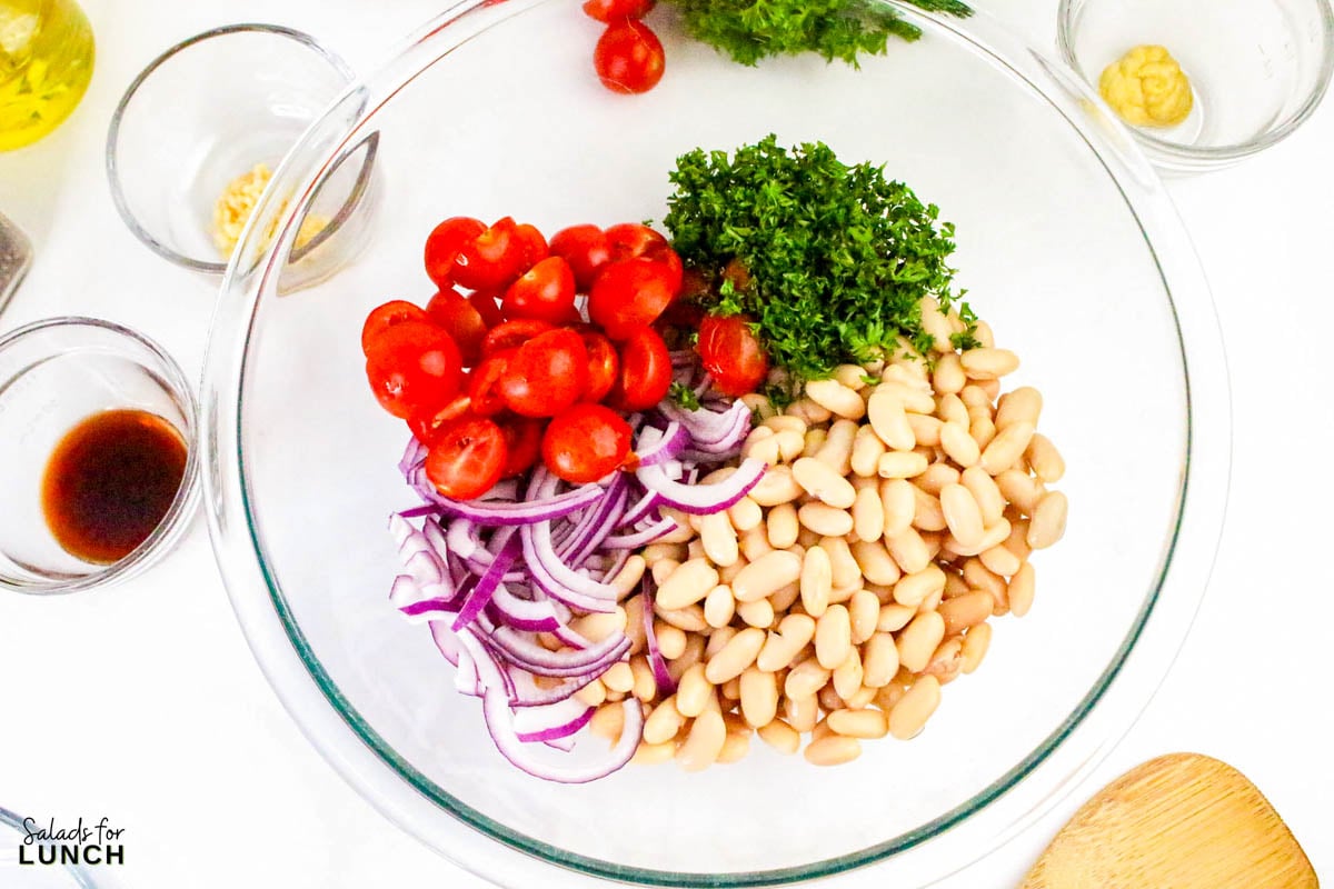 Italian White Bean Salad Recipe 4 - Whether you’re throwing together lunch for one or whipping something up for a potluck, this simple Italian white bean salad recipe checks all the boxes: tasty, satisfying, and ready in minutes.