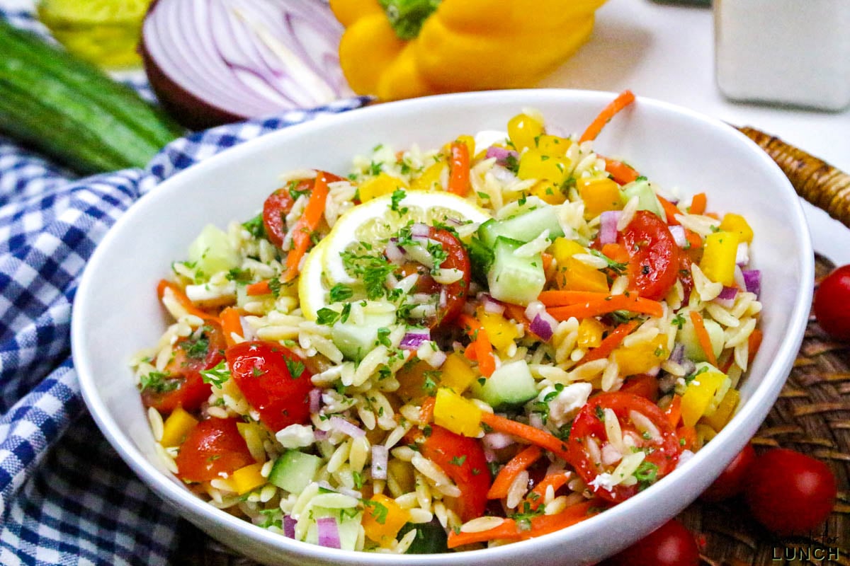 Rainbow Orzo Salad - Rainbow Orzo Salad Recipe 15 Rainbow pasta salad recipe with lemon dressing in a white bowl.