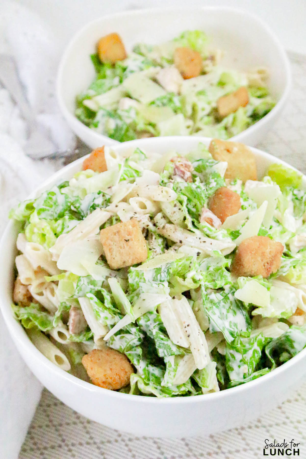 Caesar Pasta Salad Recipe 16 - If you love Caesar salad and pasta salad, then this Pasta Caesar Salad Recipe is going to be your new obsession! It’s got everything we adore about the traditional Caesar — crisp romaine, crunchy croutons, and a creamy, tangy dressing — mixed together with tender pasta for that hearty, satisfying bite. This Caesar Pasta Salad with Homemade Dressing is a total crowd-pleaser for potlucks, family dinners, or an easy weekday lunch.