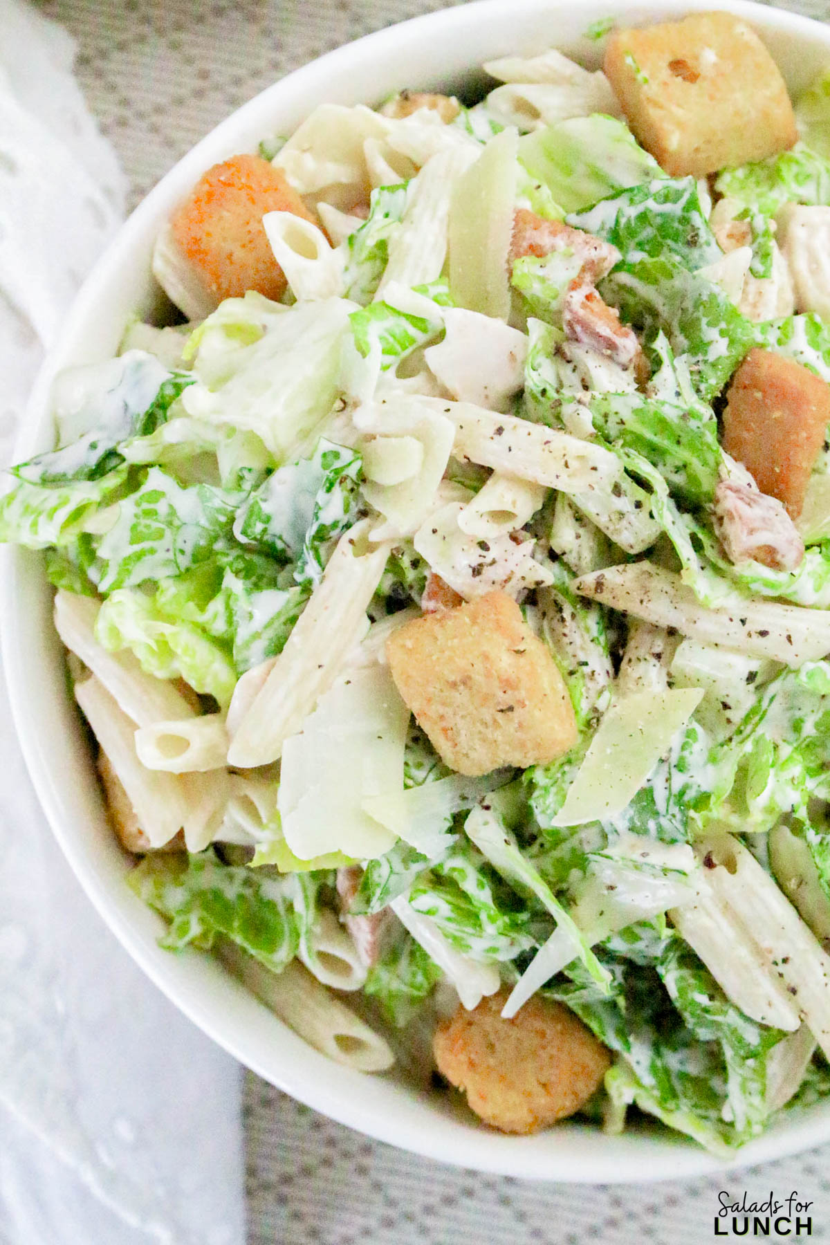 Caesar Pasta Salad Recipe 20 - If you love Caesar salad and pasta salad, then this Pasta Caesar Salad Recipe is going to be your new obsession! It’s got everything we adore about the traditional Caesar — crisp romaine, crunchy croutons, and a creamy, tangy dressing — mixed together with tender pasta for that hearty, satisfying bite. This Caesar Pasta Salad with Homemade Dressing is a total crowd-pleaser for potlucks, family dinners, or an easy weekday lunch.