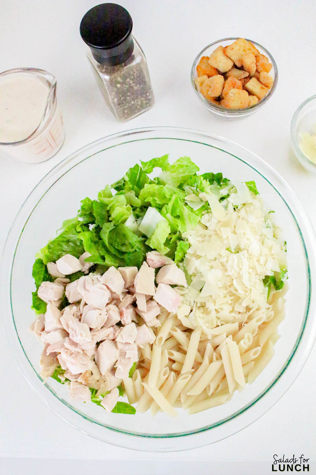 Caesar Pasta Salad Recipe 3 - If you love Caesar salad and pasta salad, then this Pasta Caesar Salad Recipe is going to be your new obsession! It’s got everything we adore about the traditional Caesar — crisp romaine, crunchy croutons, and a creamy, tangy dressing — mixed together with tender pasta for that hearty, satisfying bite. This Caesar Pasta Salad with Homemade Dressing is a total crowd-pleaser for potlucks, family dinners, or an easy weekday lunch.