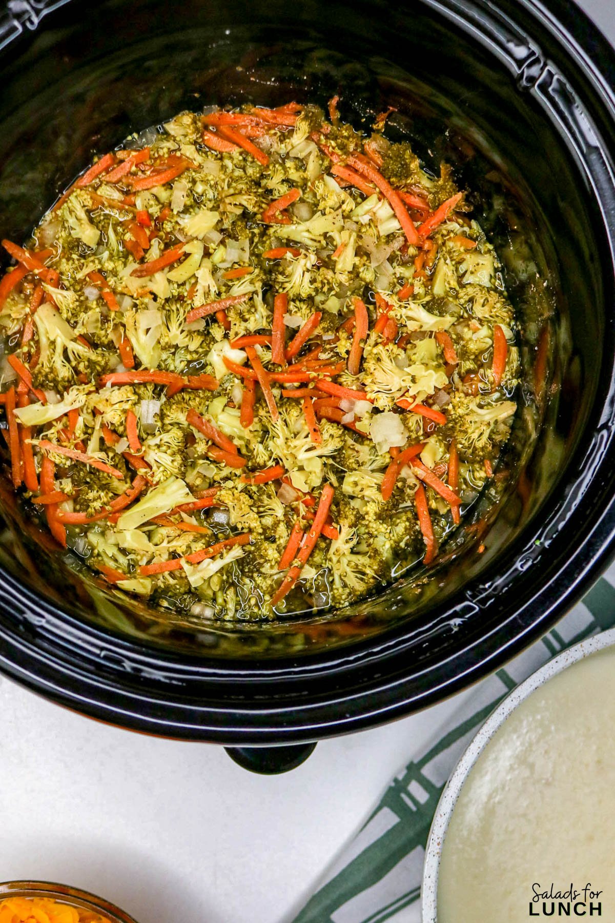 Easy Slow Cooker Broccoli Cheddar Soup - Slow Cooker Broccoli Cheddar Soup Recipe 11 Slow Cooker Broccoli Cheddar Soup Recipe 11 - A warm, cheesy bowl of comfort that practically cooks itself โ yes, please! This Healthy Broccoli Cheddar Soup is creamy, cozy, and full of flavor. Itโs one of those meals that fills your kitchen with the most amazing aroma while the slow cooker does all the heavy lifting. Perfect for chilly nights, this Broccoli Cheddar Soup Slow Cooker recipe tastes like your favorite cafรฉ version (hello, Copycat Panera Broccoli Cheddar Soup), but with a wholesome homemade twist.