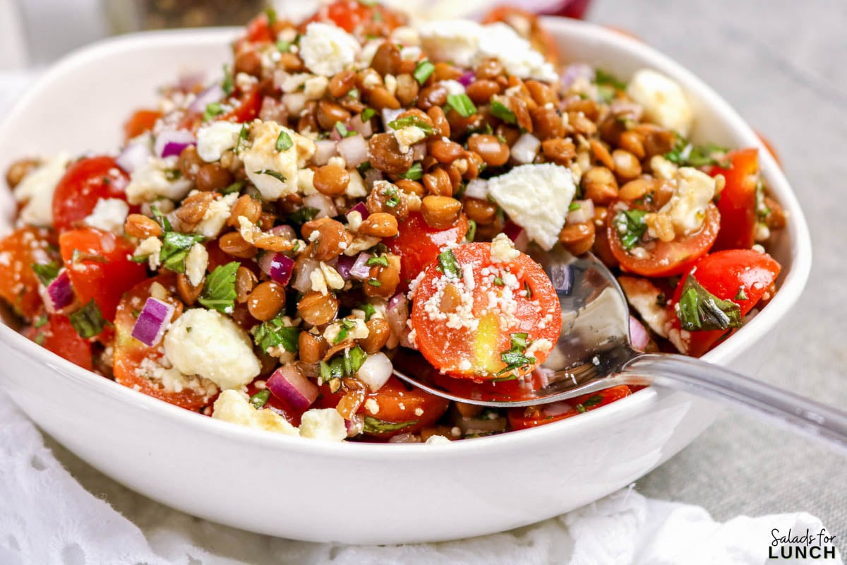 Healthy bruschetta lentil salad with feta cheese tossed in balsamic dressing.