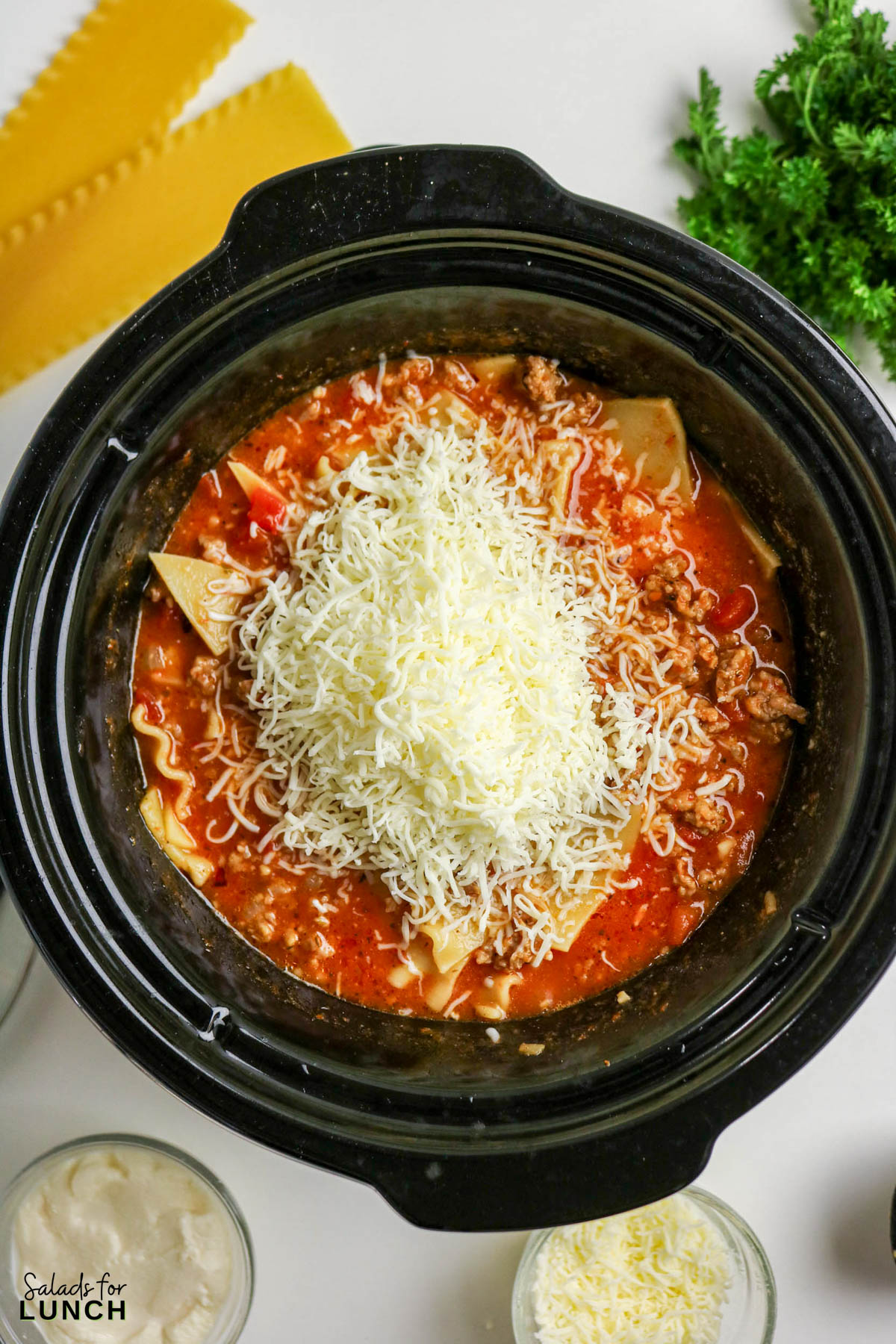 Easy Lasagna Soup Recipe 9 - Slow Cooker Lasagna Soup takes everything you crave about classic lasagna and turns it into a cozy, spoonable dinner. Think rich tomato broth, tender pasta pieces, savory meat, and melty cheese in every bite—without layering noodles or babysitting the oven. The slow cooker does the heavy lifting, making this a perfect weeknight dinner for chilly days.