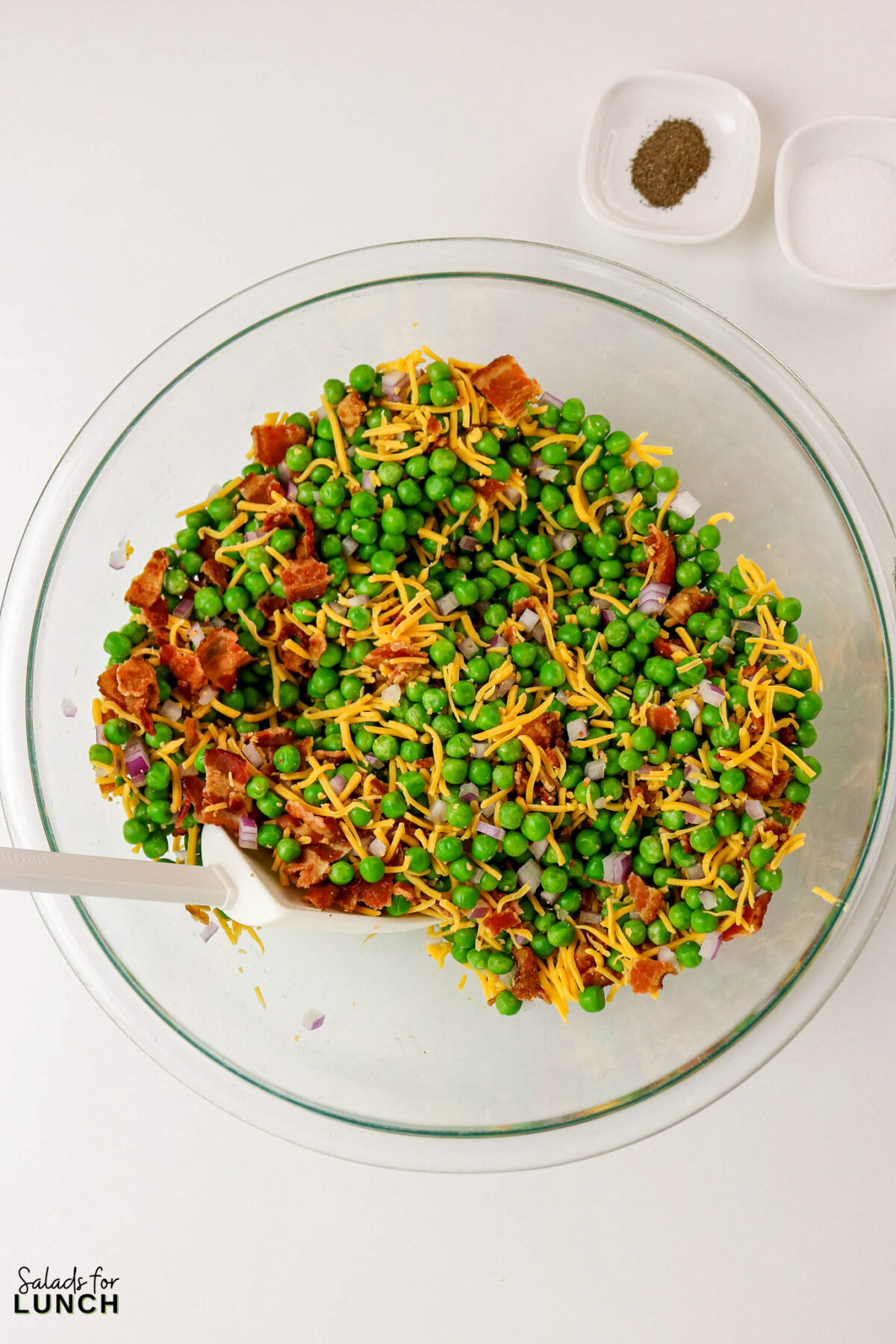 Classic Pea Salad with Bacon and Cheese (No Mayo) - Pea Salad Recipe No Mayo 03 Pea Salad Recipe No Mayo 03 - Say goodbye to heavy, overly-mayo-laden recipes, and say hello to this bright, light, and flavor-packed Classic Pea Salad. This isn’t your grandmother’s creamy classic (although we love hers too!); this version uses a light, tangy sour cream-based dressing that makes every spoonful feel fresh and wonderful. It’s the simple, cold side dish that perfectly complements any grilled chicken or baked fish.