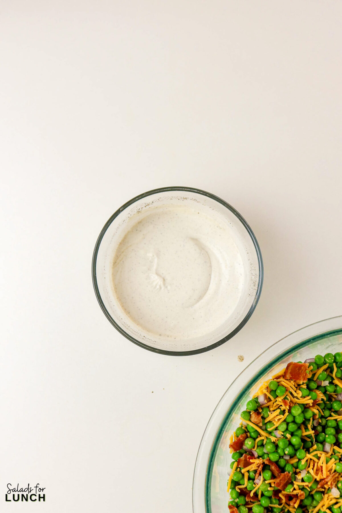 Classic Pea Salad with Bacon and Cheese (No Mayo) - Pea Salad Recipe No Mayo 05 Pea Salad Recipe No Mayo 05 - Say goodbye to heavy, overly-mayo-laden recipes, and say hello to this bright, light, and flavor-packed Classic Pea Salad. This isn’t your grandmother’s creamy classic (although we love hers too!); this version uses a light, tangy sour cream-based dressing that makes every spoonful feel fresh and wonderful. It’s the simple, cold side dish that perfectly complements any grilled chicken or baked fish.