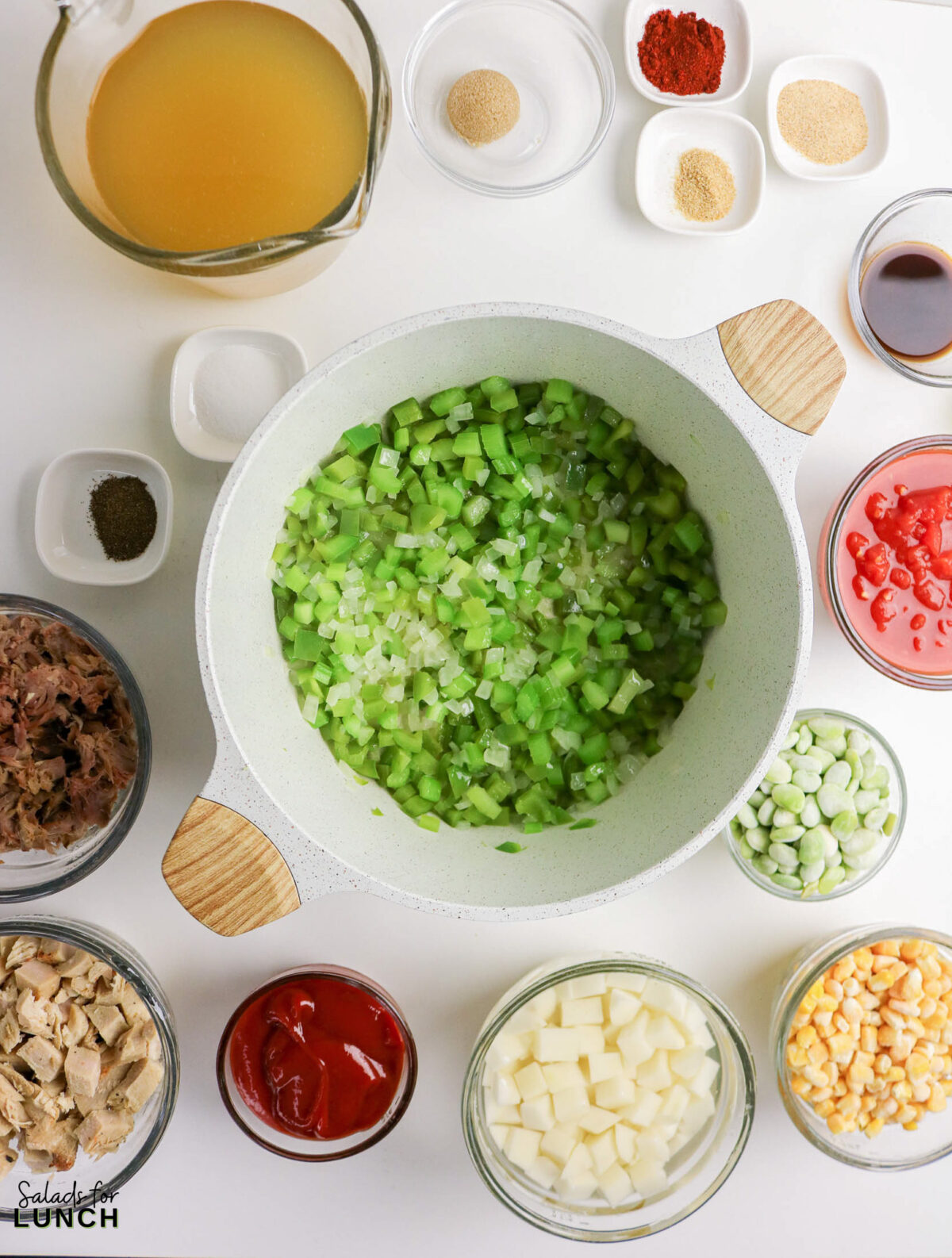 Ingredients for easy Brunswick stew recipe: chopped vegetables, chicken, pork, broth, and spices.