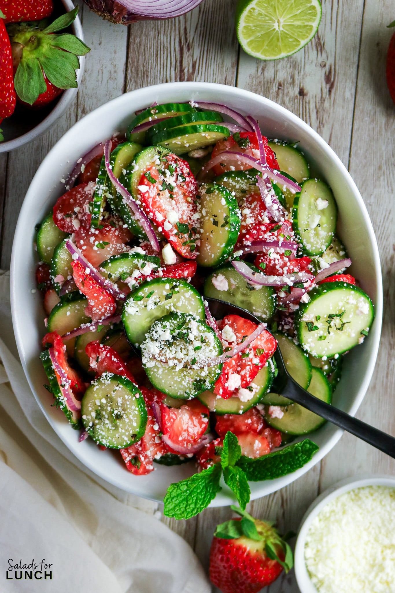 Strawberry Cucumber Salad Recipe 02 - Fresh and easy strawberry cucumber salad with feta and mint, tossed in a sweet honey lime dressing. A light summer side dish ready in just 15 minutes.