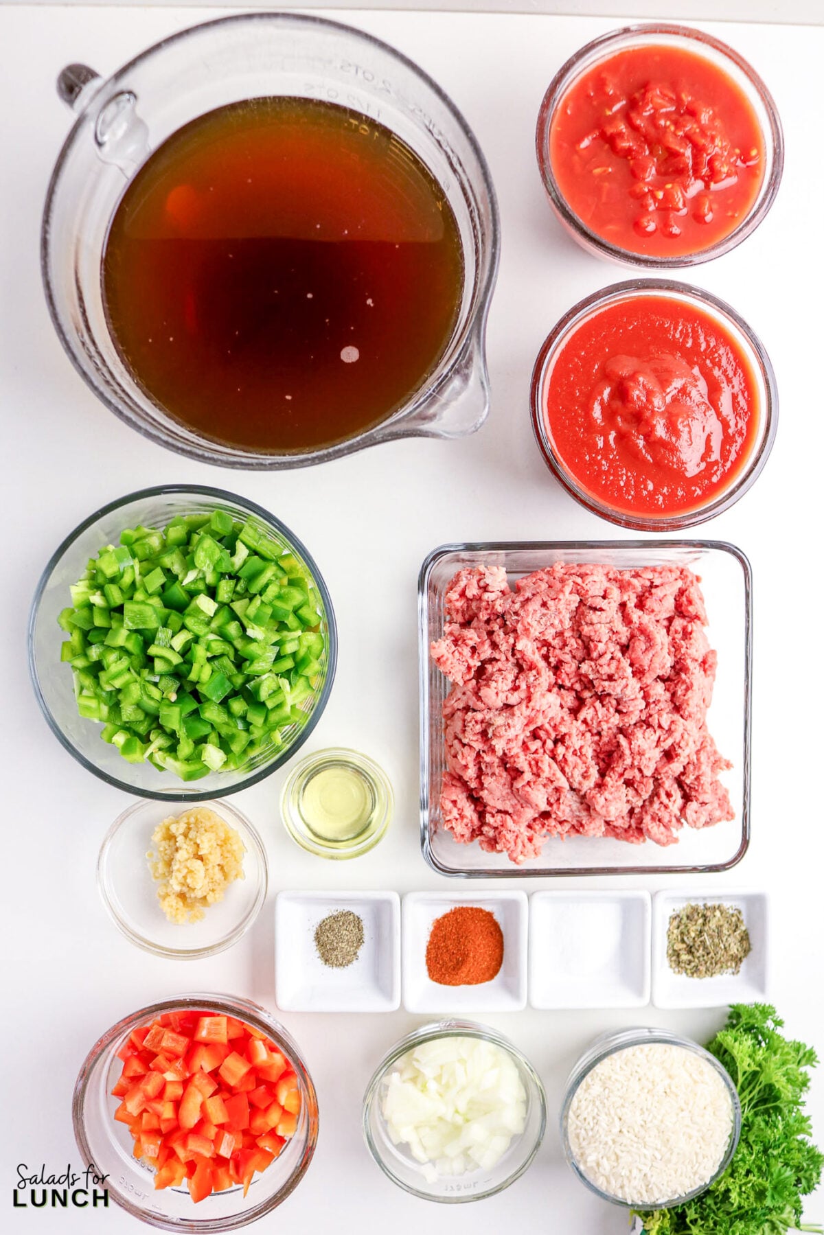 Stuffed Pepper Soup ingredients: ground beef, diced red and green peppers, diced onions, diced garlic, tomatoes, beef broth, and spices.