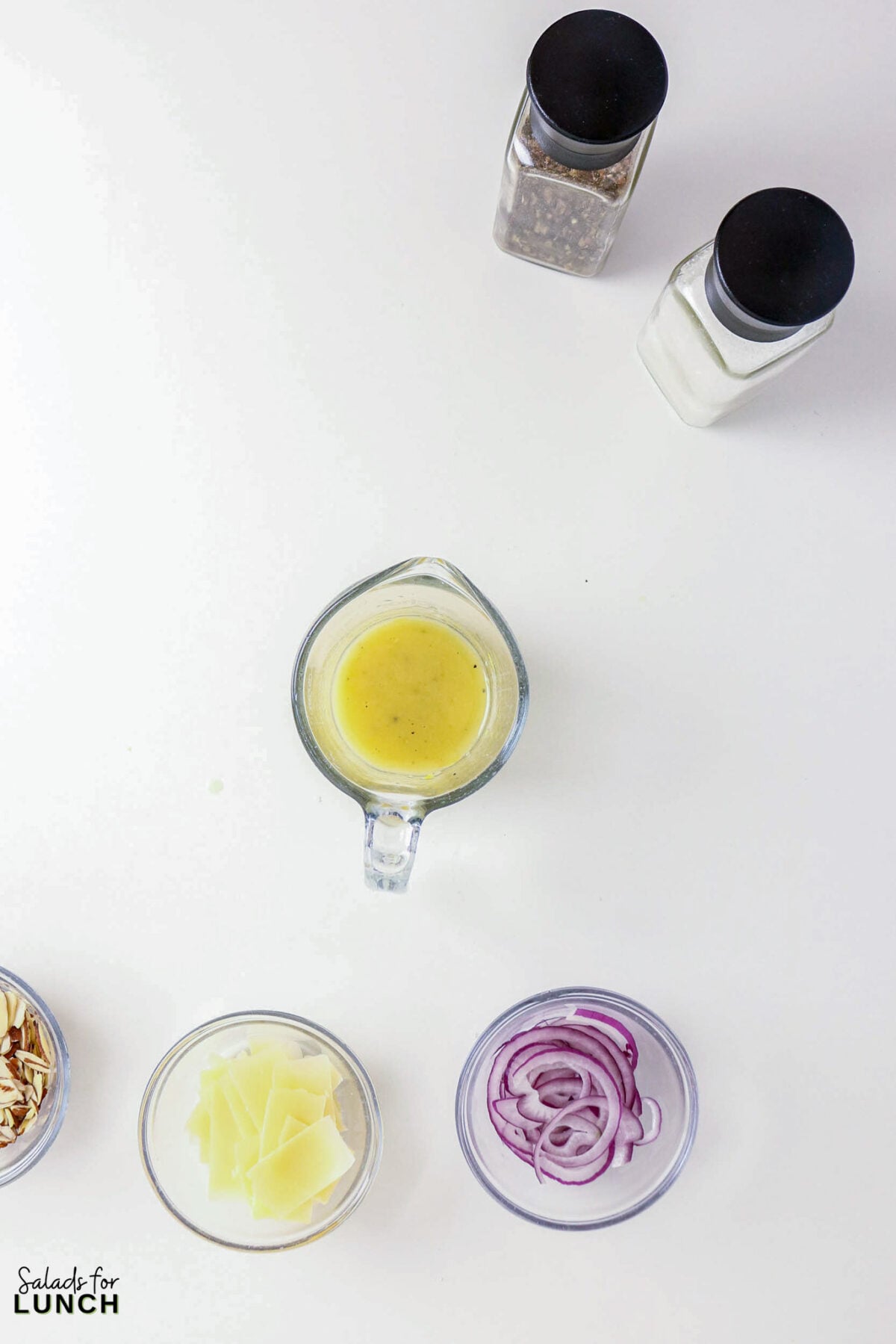 Shaved Asparagus Salad with Lemon Vinaigrette - salad ingredients dressing nuts cheese onion Salad ingredients: dressing, almonds, cheese, red onion, and seasonings.