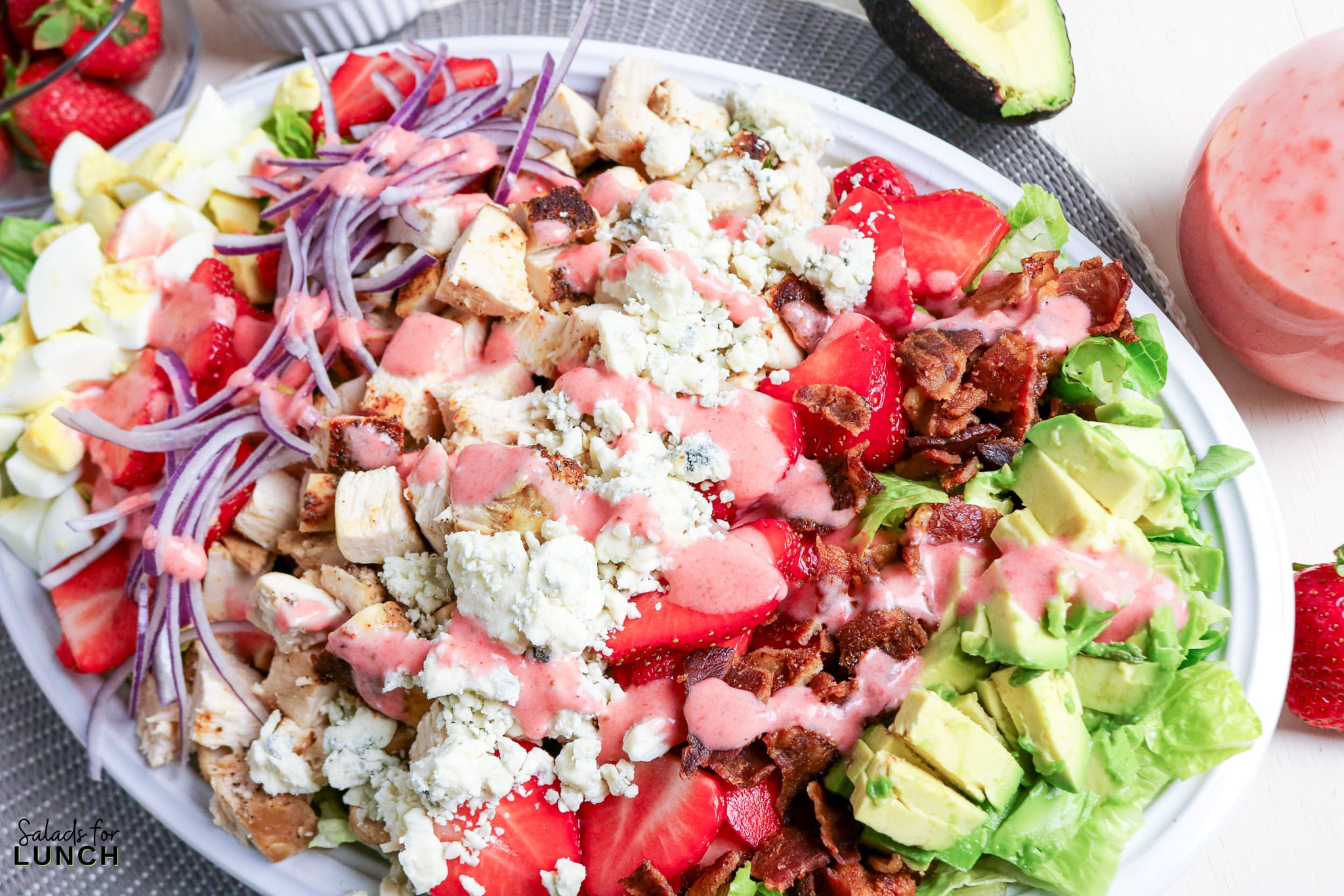 Strawberry Chicken Cobb Salad with Creamy Strawberry Vinaigrette - strawberry avocado chicken salad Strawberry avocado chicken salad with bacon, blue cheese, and red onion drizzle.
