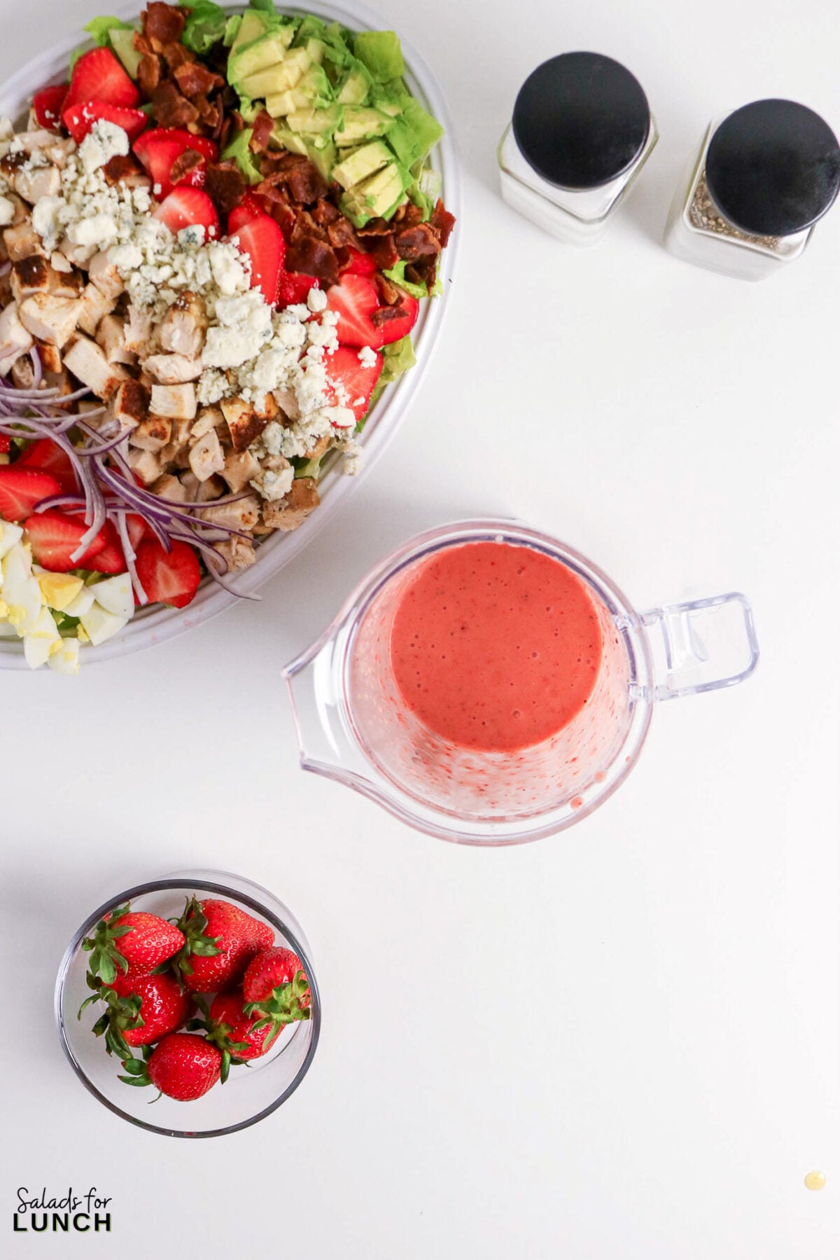 Strawberry Chicken Cobb Salad with Creamy Strawberry Vinaigrette - strawberry chicken salad avocado bacon dressing Strawberry chicken salad with avocado, bacon, blue cheese, and red onion, with dressing.
