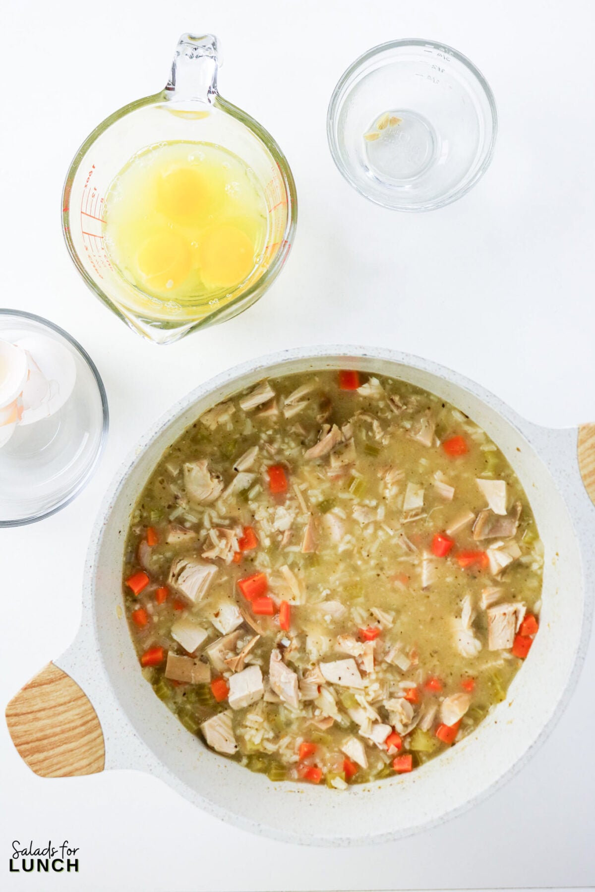 Greek Lemon Chicken and Rice Soup (Easy Avgolemono Recipe) - Greek Lemon Chicken Soup with Rice Recipe 31 Eggs and lemon juice in a measuring cup ready to be tempered into the pot of chicken and rice soup.