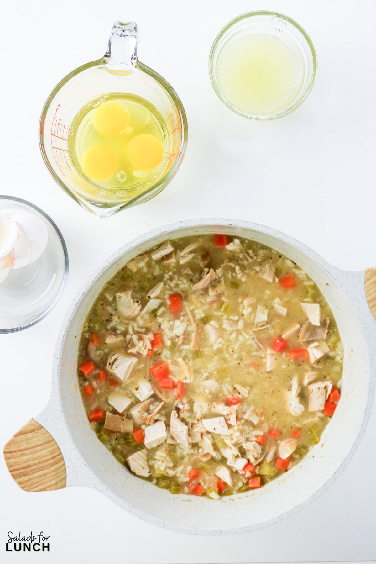 Greek Lemon Chicken and Rice Soup (Easy Avgolemono Recipe) - Greek Lemon Chicken Soup with Rice Recipe 32 Pot of chicken, rice, and vegetable soup with eggs and lemon juice ready to be tempered and stirred in