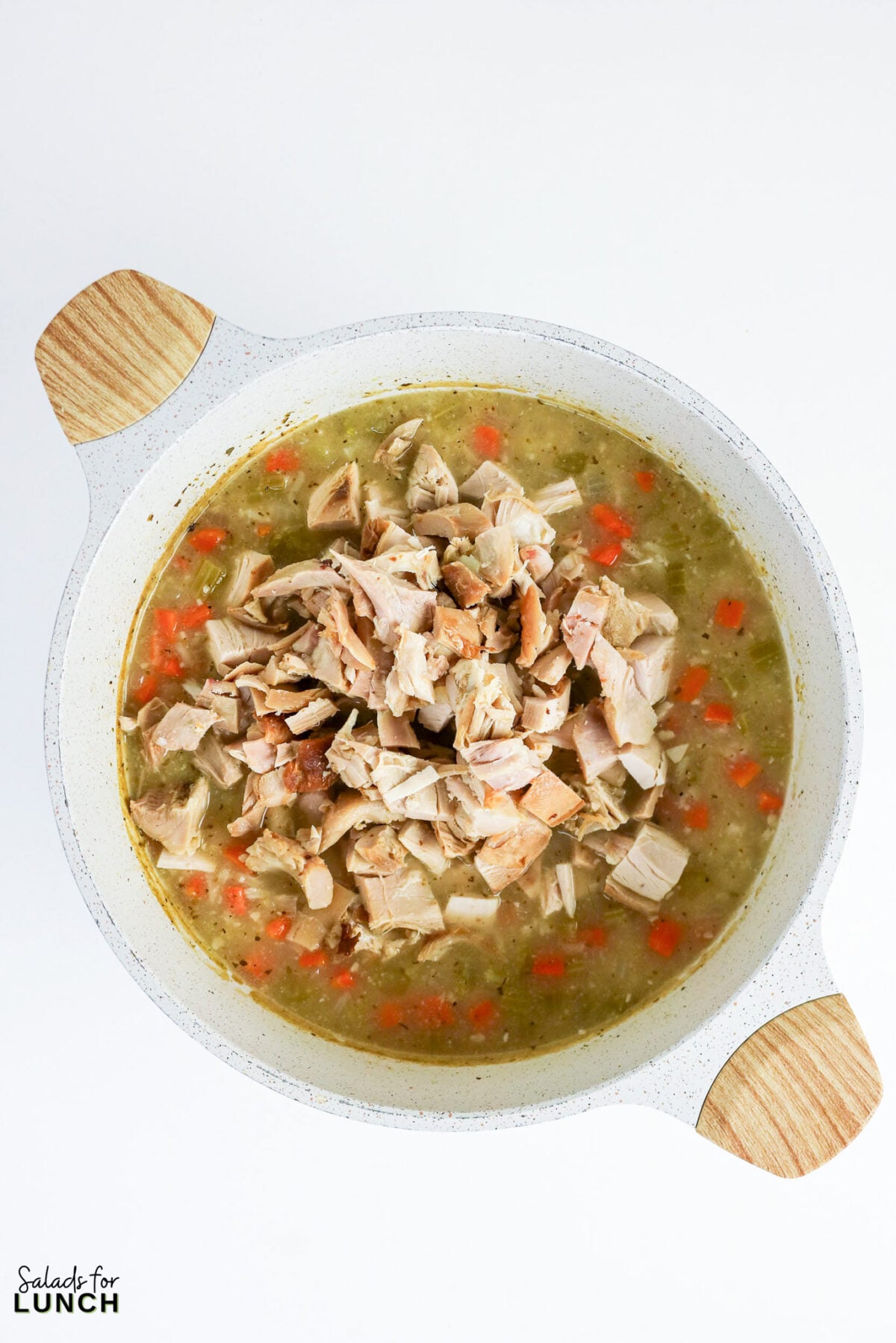 Greek Lemon Chicken and Rice Soup (Easy Avgolemono Recipe) - Greek Lemon Chicken Soup with Rice Recipe 33 Shredded cooked chicken added to the pot of rice and vegetable broth before the egg-lemon mixture is stirred in.