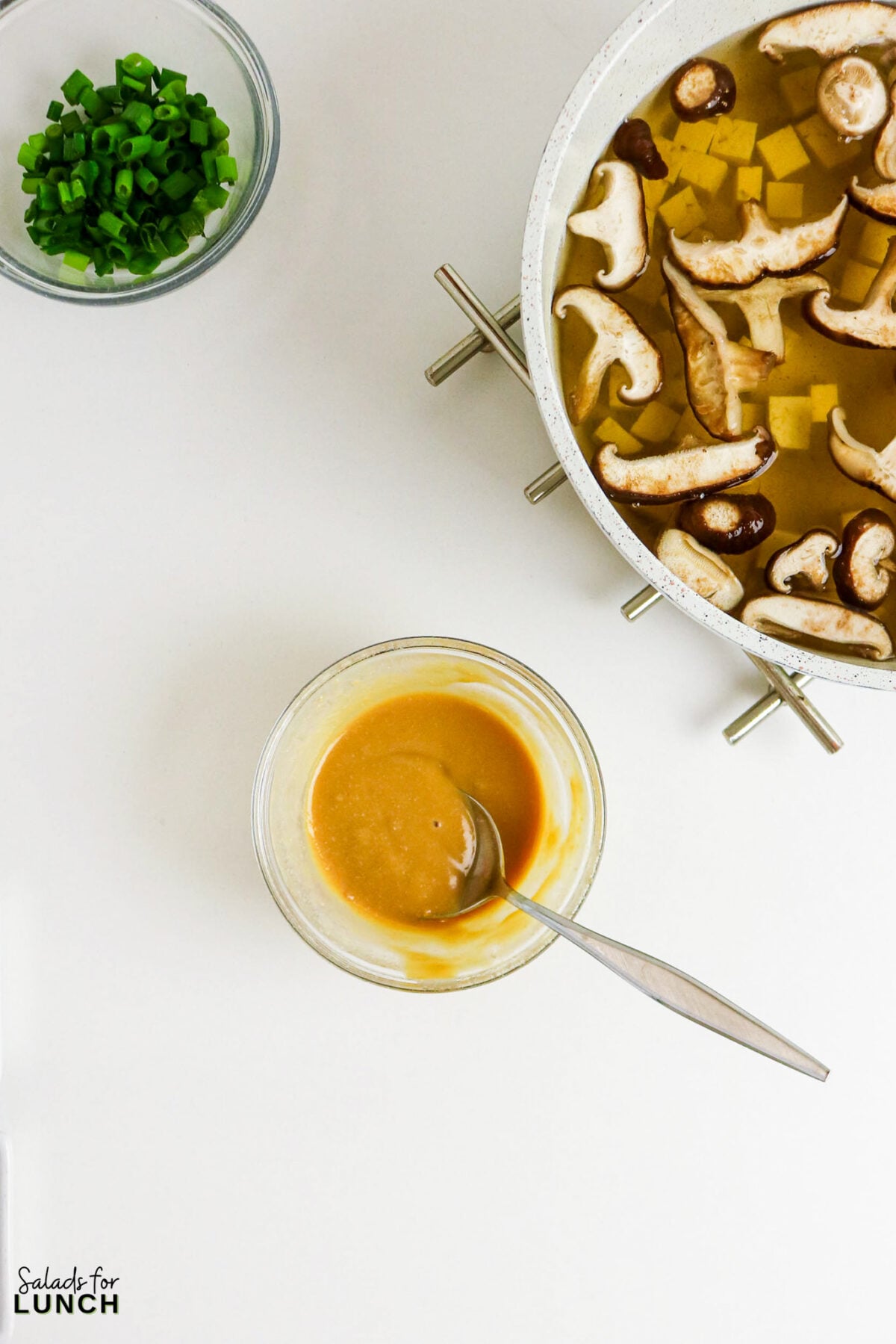 Easy Miso Soup with Mushrooms - Miso Soup Recipe With Mushrooms 26 Miso paste whisked smooth with hot broth in a small bowl, ready to stir into the pot of mushrooms and tofu.