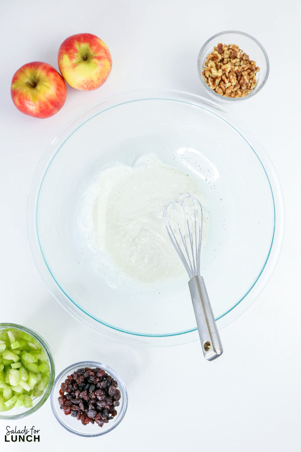 Apple, Celery & Walnut Crunch Salad - Process Apple Celery Walnut Salad 3 Process Apple Celery Walnut Salad 3 - This crisp salad combines sweet apples, crunchy celery, toasted walnuts and raisins in a light Greek yogurt dressing — no mayo, no cooking, ready in 15 minutes.