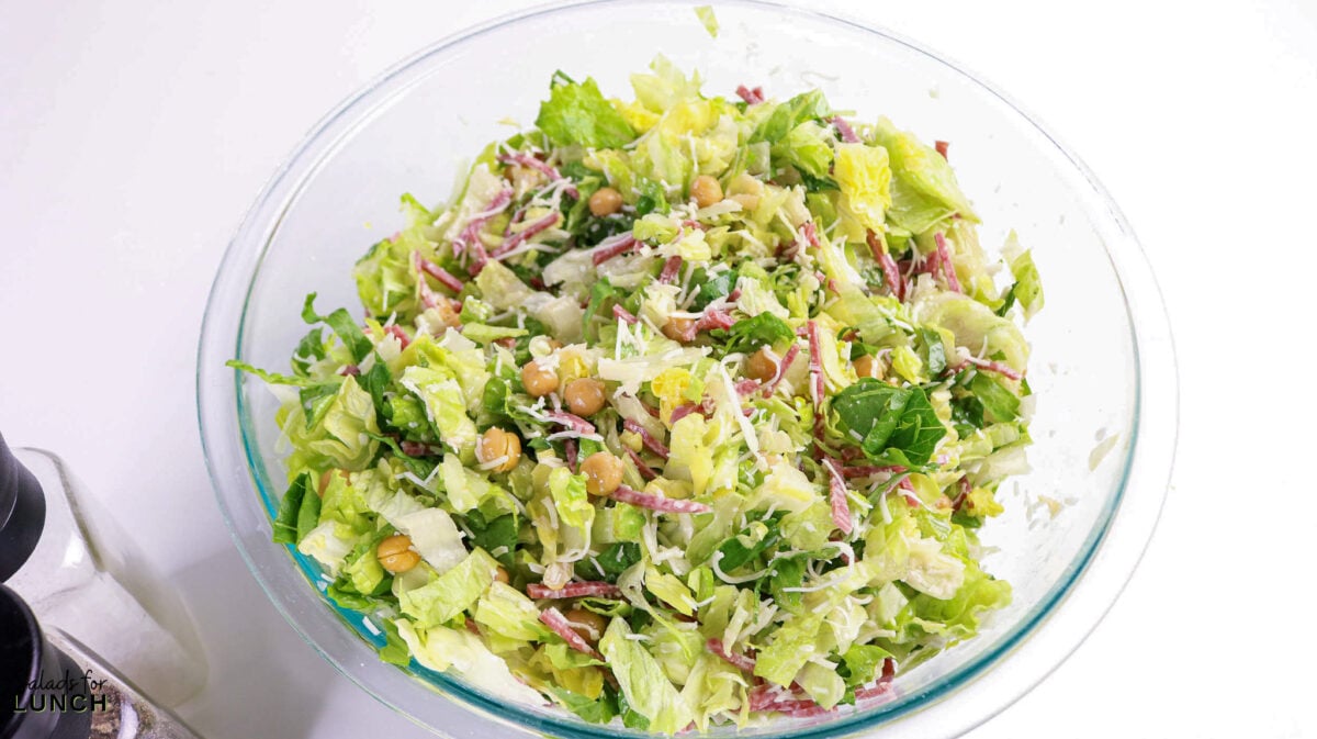 La Scala Chopped Salad Recipe (Easy Beverly Hills Copycat) - Process La Scala Italian Chopped Salad 1 Process La Scala Italian Chopped Salad 1 - This Italian-inspired chopped salad is crisp and flavorful, combining crunchy iceberg and romaine with savory salami, tender chickpeas, and creamy mozzarella tossed in a tangy red wine vinaigrette. It's a restaurant-style salad that's easy to make at home and works as a light lunch or party side.