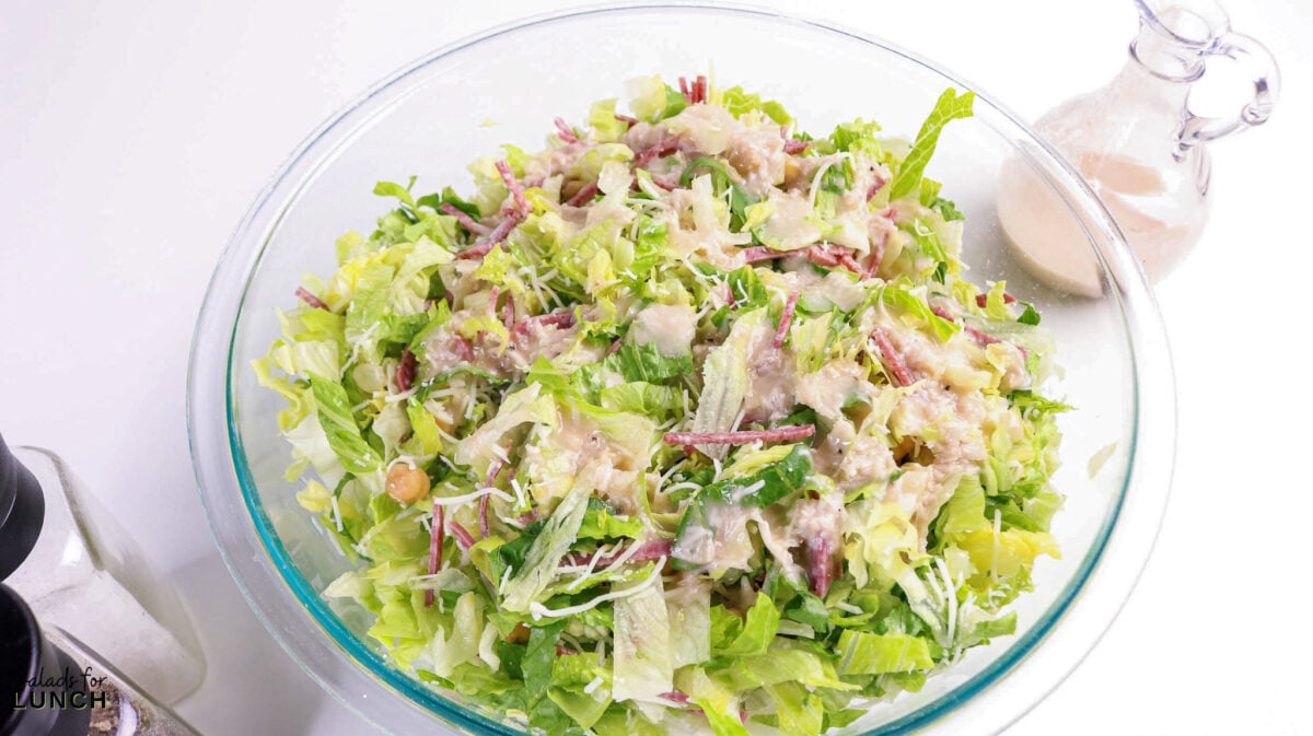 La Scala Chopped Salad Recipe (Easy Beverly Hills Copycat) - Process La Scala Italian Chopped Salad 2 Process La Scala Italian Chopped Salad 2 - This Italian-inspired chopped salad is crisp and flavorful, combining crunchy iceberg and romaine with savory salami, tender chickpeas, and creamy mozzarella tossed in a tangy red wine vinaigrette. It's a restaurant-style salad that's easy to make at home and works as a light lunch or party side.