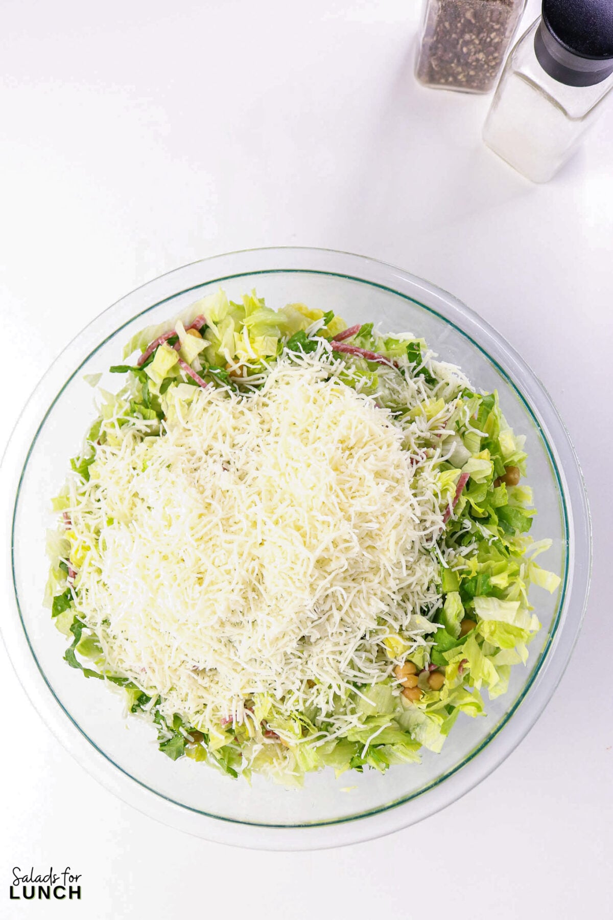 La Scala Chopped Salad Recipe (Easy Beverly Hills Copycat) - Process La Scala Italian Chopped Salad 3 Process La Scala Italian Chopped Salad 3 - This Italian-inspired chopped salad is crisp and flavorful, combining crunchy iceberg and romaine with savory salami, tender chickpeas, and creamy mozzarella tossed in a tangy red wine vinaigrette. It's a restaurant-style salad that's easy to make at home and works as a light lunch or party side.