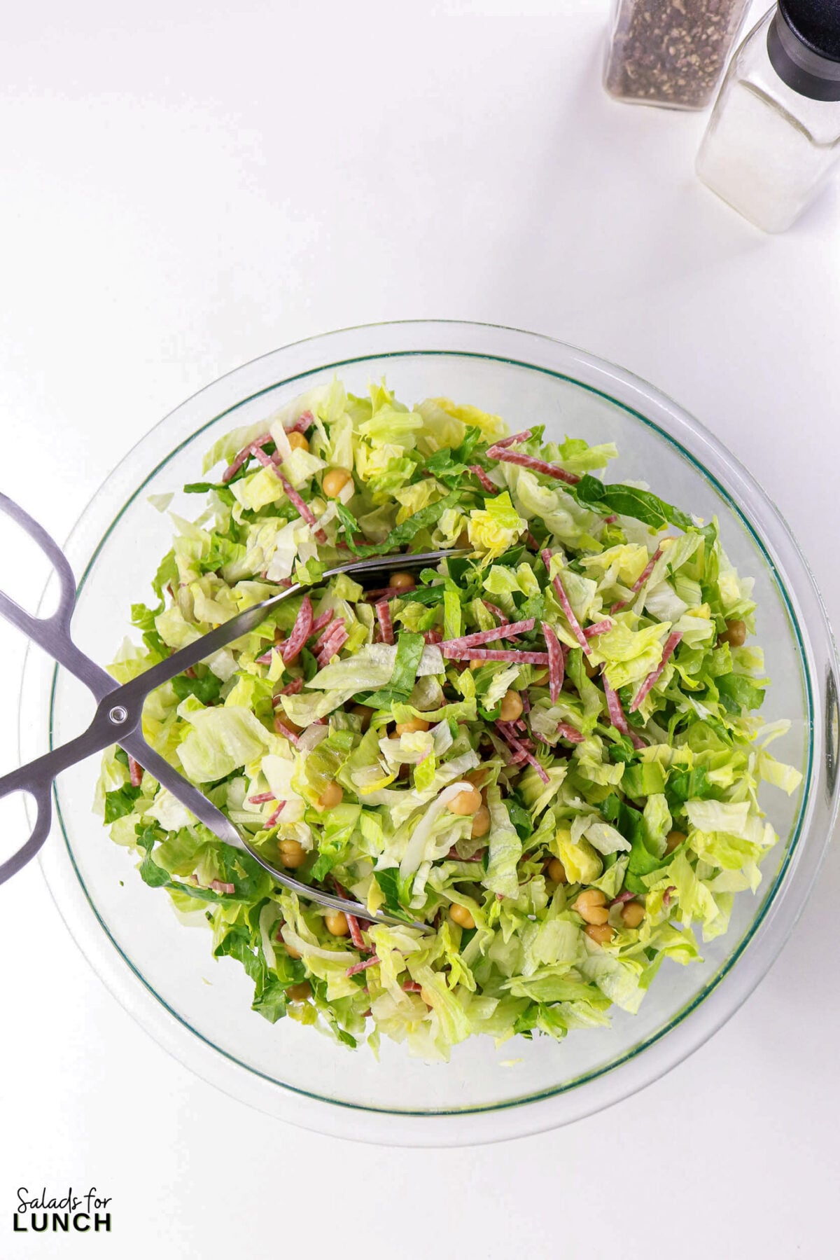 La Scala Chopped Salad Recipe (Easy Beverly Hills Copycat) - Process La Scala Italian Chopped Salad 4 Process La Scala Italian Chopped Salad 4 - This Italian-inspired chopped salad is crisp and flavorful, combining crunchy iceberg and romaine with savory salami, tender chickpeas, and creamy mozzarella tossed in a tangy red wine vinaigrette. It's a restaurant-style salad that's easy to make at home and works as a light lunch or party side.