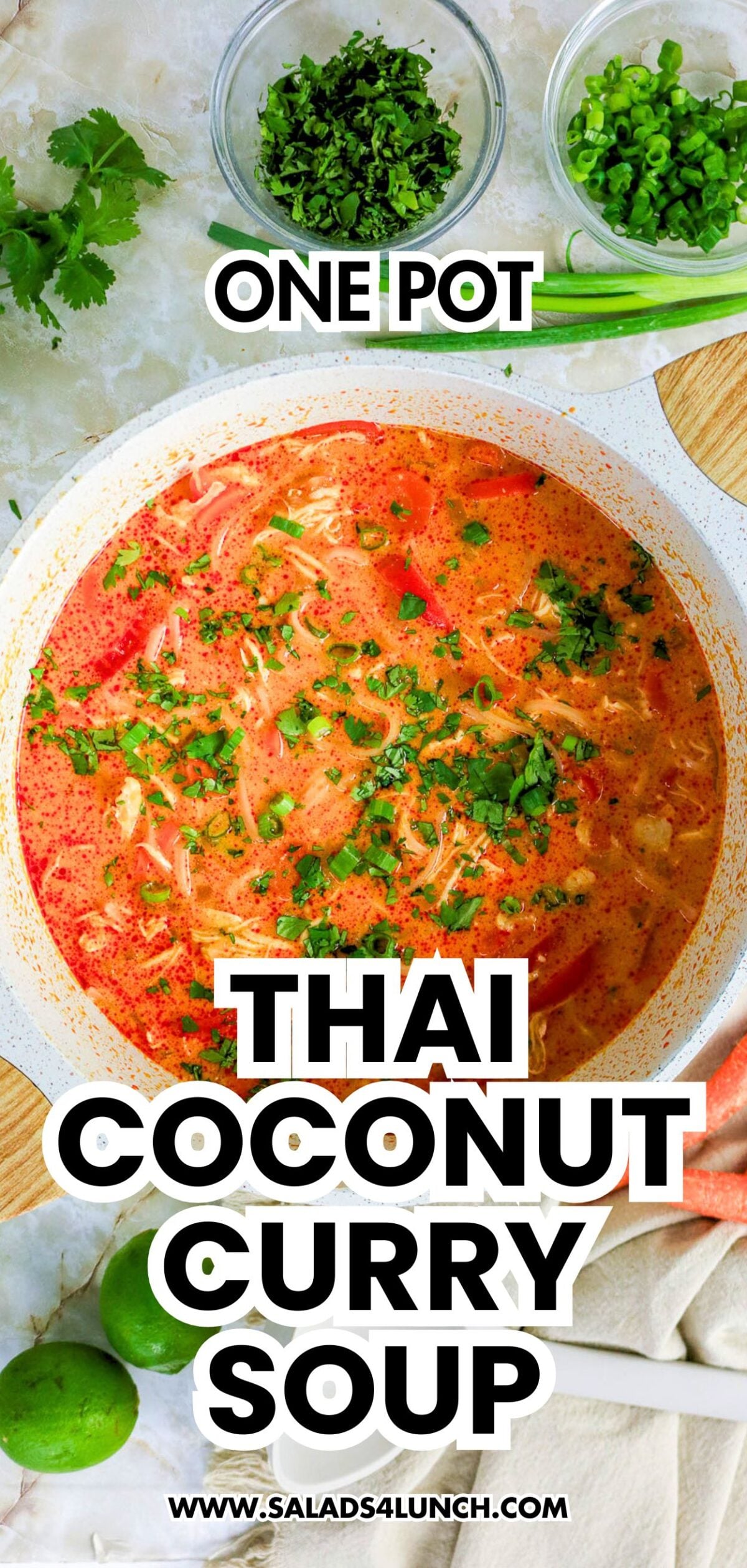 One Pot Thai Coconut Curry Soup with shredded chicken, tomatoes, and herbs, topped with cilantro and green onions.