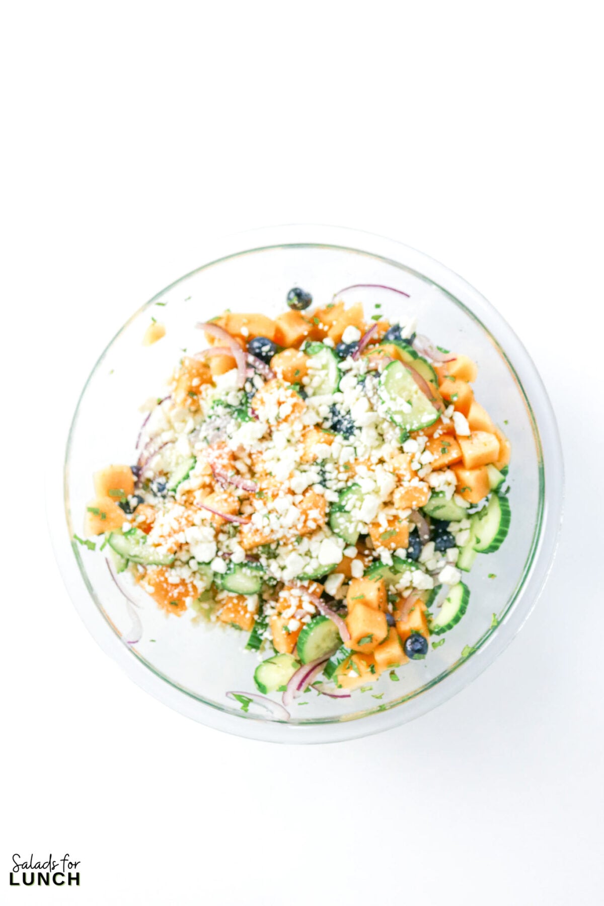 Cantaloupe Cucumber Feta Salad - Cantaloupe Salad Process 2 Cantaloupe Salad Process 2 - A refreshing no-cook salad with sweet cantaloupe, crisp cucumber, blueberries, and feta in a honey lime dressing, ready in 15 minutes.
