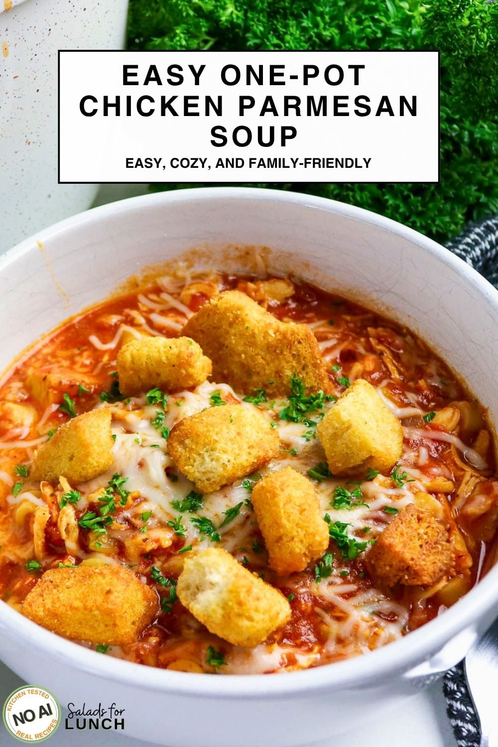 One-Pot Chicken Parmesan Soup - Easy One Pot Chicken Parmesan Soup Bowl of chicken parmesan soup topped with melted mozzarella, parsley, and golden croutons, text reads Easy One-Pot Chicken Parmesan Soup.